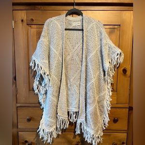 Knit sweater with fringe